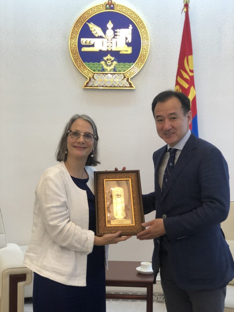 Minister Tsogtbaatar.D presents Ambassador Barsacq with a gift to honor her service in Mongolia.